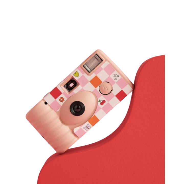 Pink checkered disposable camera with playful fruit and heart icons from Parte Haus party supply store in Bethesda MD