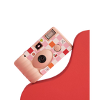 Pink checkered disposable camera with playful fruit and heart icons from Parte Haus party supply store in Bethesda MD