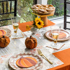 Orange falling leaves paper placemats with pumpkin accents Thanksgiving from Parte Haus party supply store in Bethesda MD