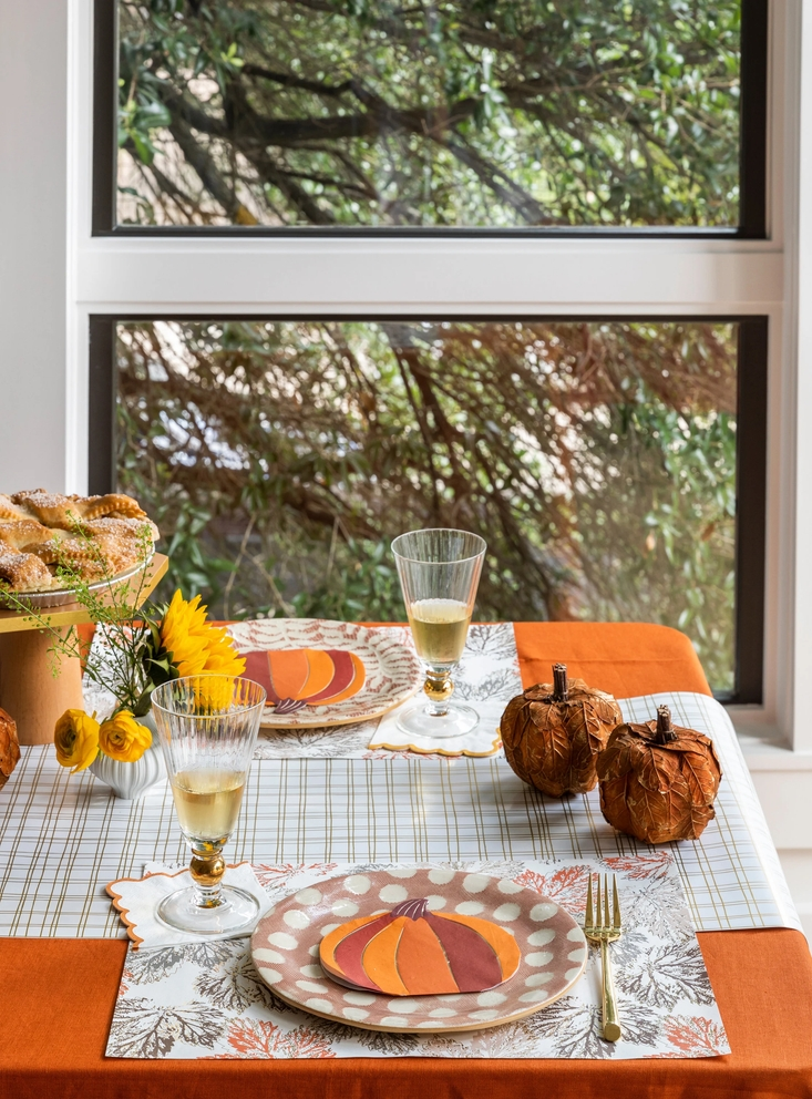 Orange and brown falling leaves paper placemats with pumpkin design fall theme from Parte Haus party supply store in Bethesda Maryland
