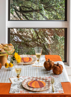 Orange and brown falling leaves paper placemats with pumpkin design fall theme from Parte Haus party supply store in Bethesda Maryland