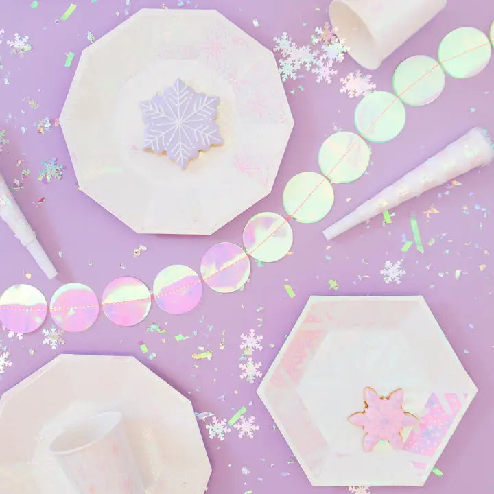 Frosted iridescent small plates with snowflakes winter theme from Parte Haus party supply store in Bethesda Maryland