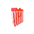 Red and white striped gift bag with tissue paper for birthday from Parte Haus party supply store in Bethesda MD.
