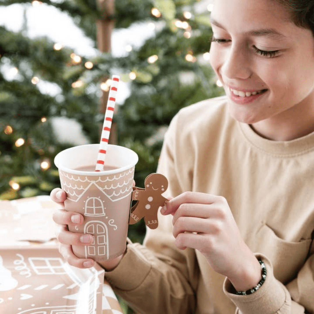 Brown gingerbread holiday cup with red striped straw Christmas theme from Parte Haus party supply store in Bethesda MD