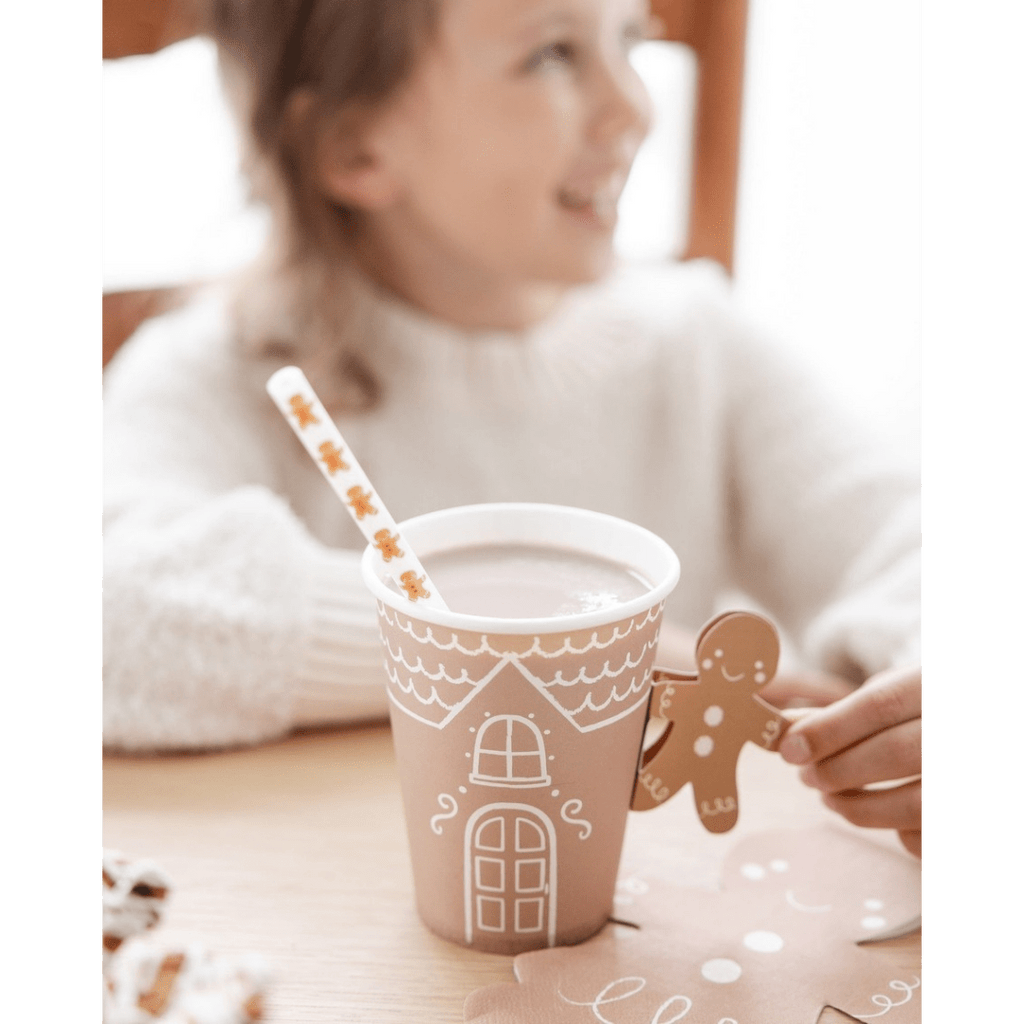 Brown gingerbread house cup with white pattern and gingerbread man holiday design from Parte Haus party supply store in Bethesda MD