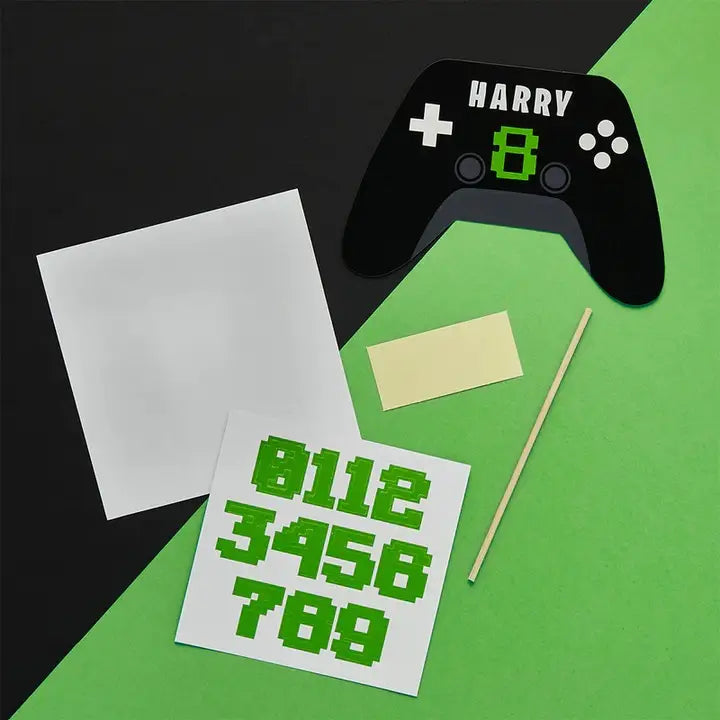 Black green game controller cake topper birthday theme from Parte Haus party supply store in Bethesda Maryland