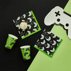 Black and green game controller paper napkins and cups for gaming birthday from Parte Haus party supply store in Bethesda, MD