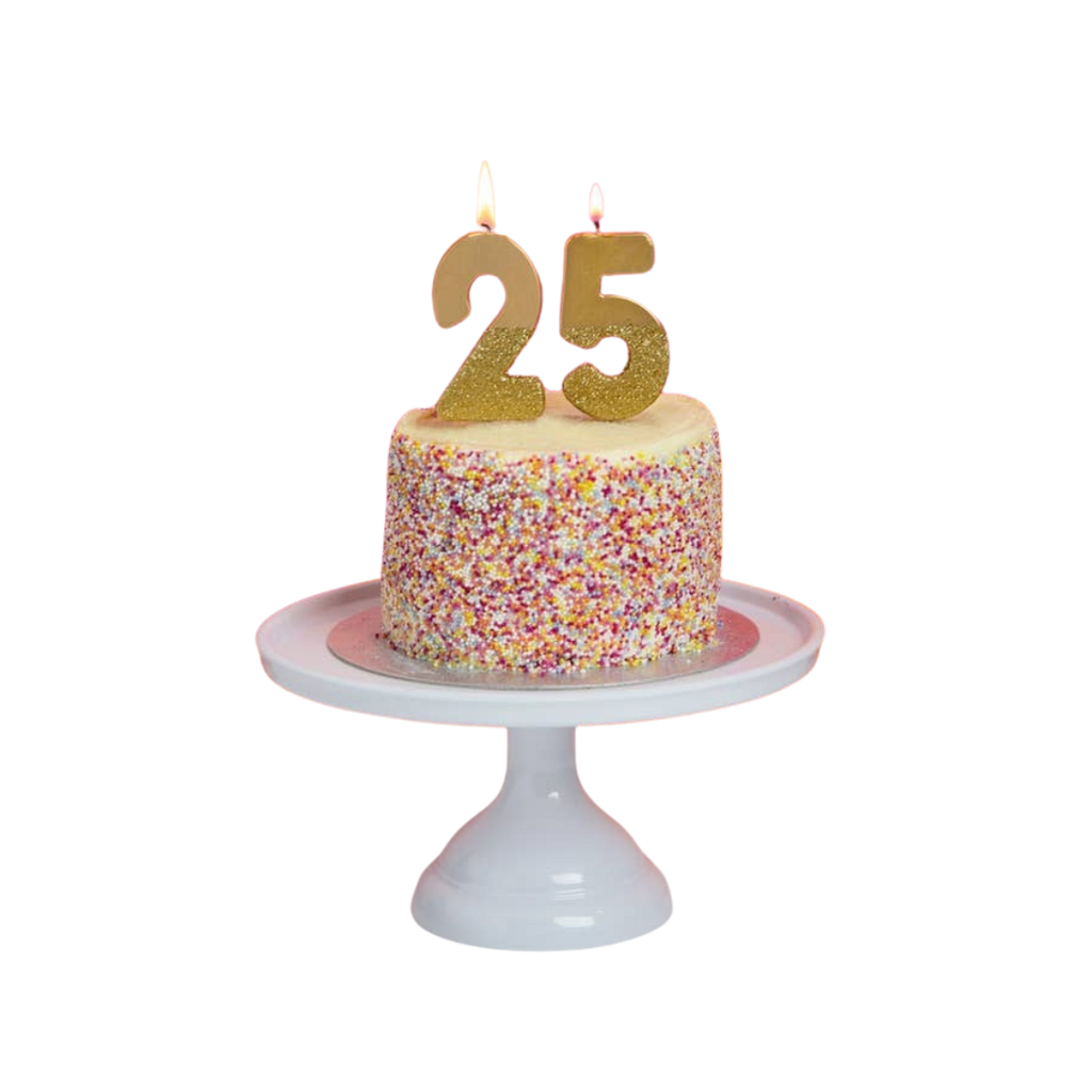 Gold glitter birthday number candles on cake for birthday celebration from Parte Haus party supply store in Bethesda MD