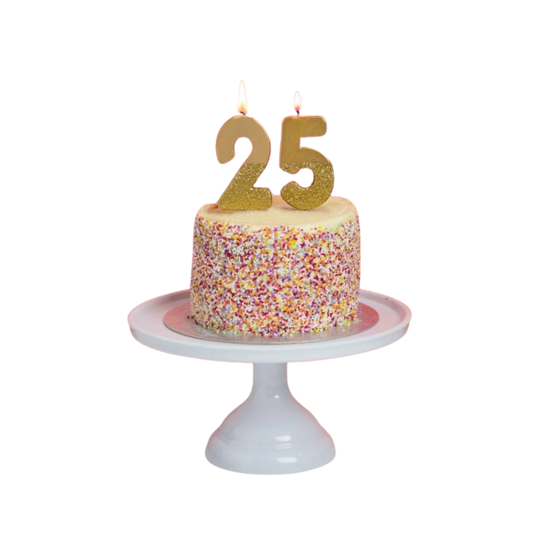 Gold glitter birthday number candles on cake for birthday celebration from Parte Haus party supply store in Bethesda MD