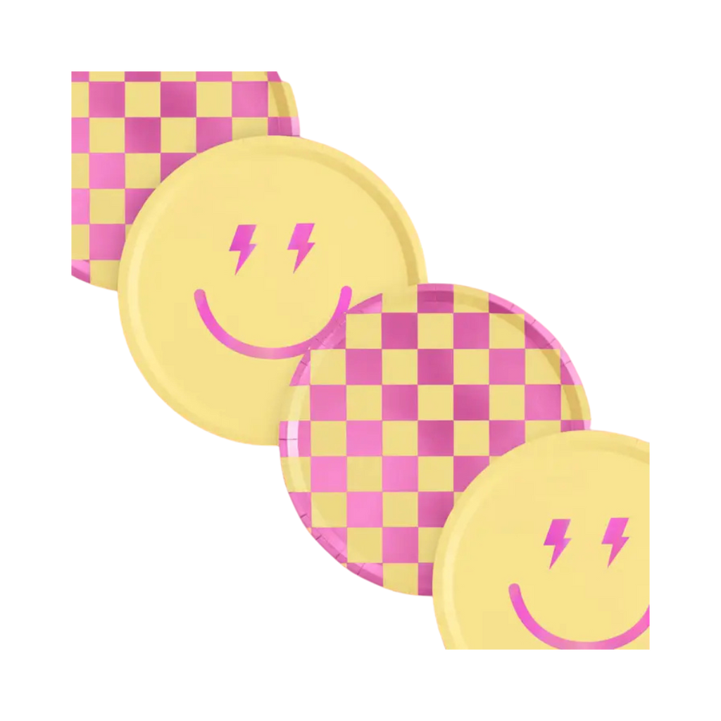 Pink and yellow checkered and smiley face plates and napkins birthday party decor from Parte Haus party supply store in Bethesda Maryland