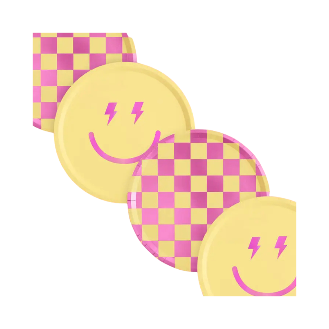Pink and yellow checkered and smiley face plates and napkins birthday party decor from Parte Haus party supply store in Bethesda Maryland