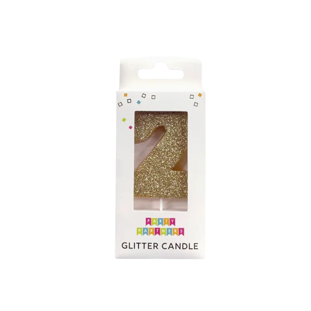 Gold glitter number two candle in packaging birthday decor from Parte Haus party supply store in Bethesda Maryland