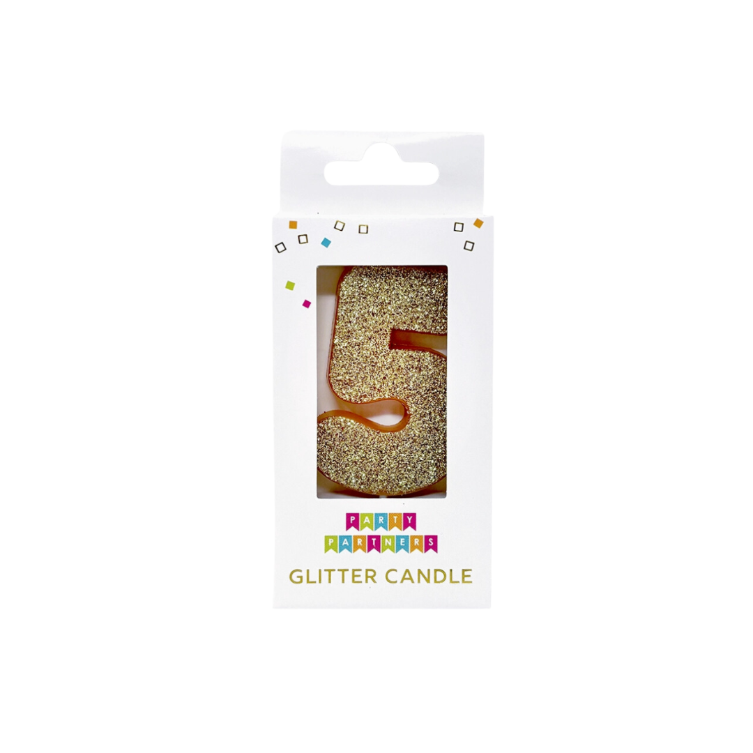 Gold glitter number five candle in box birthday theme from Parte Haus party supply store in Bethesda MD