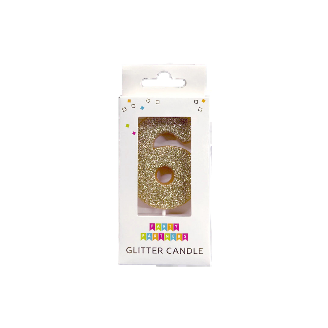 Gold glitter number 6 birthday candle in packaging from Parte Haus party supply store in Bethesda Maryland