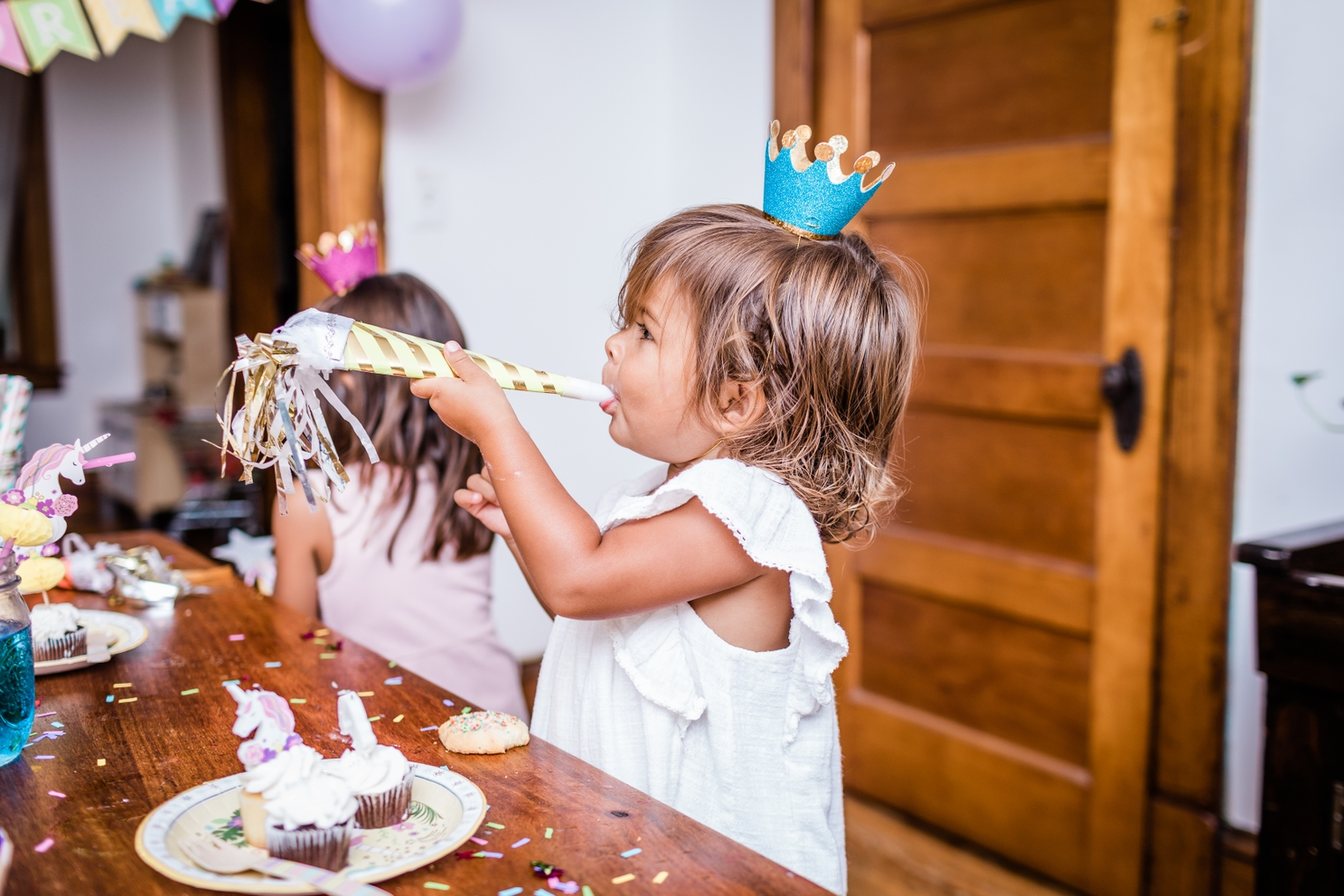 Gold mini crown headband with glitter detail for birthdays from Parte Haus party supply store in Bethesda Maryland