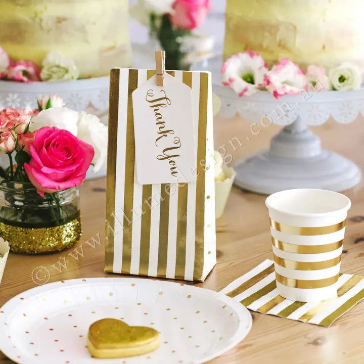Gold stripes and dots treat bag with thank you tag for celebration from Parte Haus party supply store in Bethesda MD