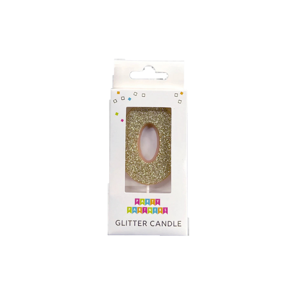 Gold glitter candle shaped like number 0 birthday decoration from Parte Haus party supply store in Bethesda MD