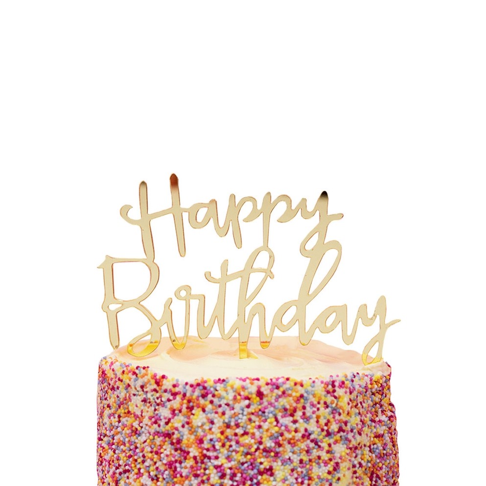 Gold happy birthday acrylic cake topper on sprinkle cake birthday theme from Parte Haus party supply store in Bethesda MD