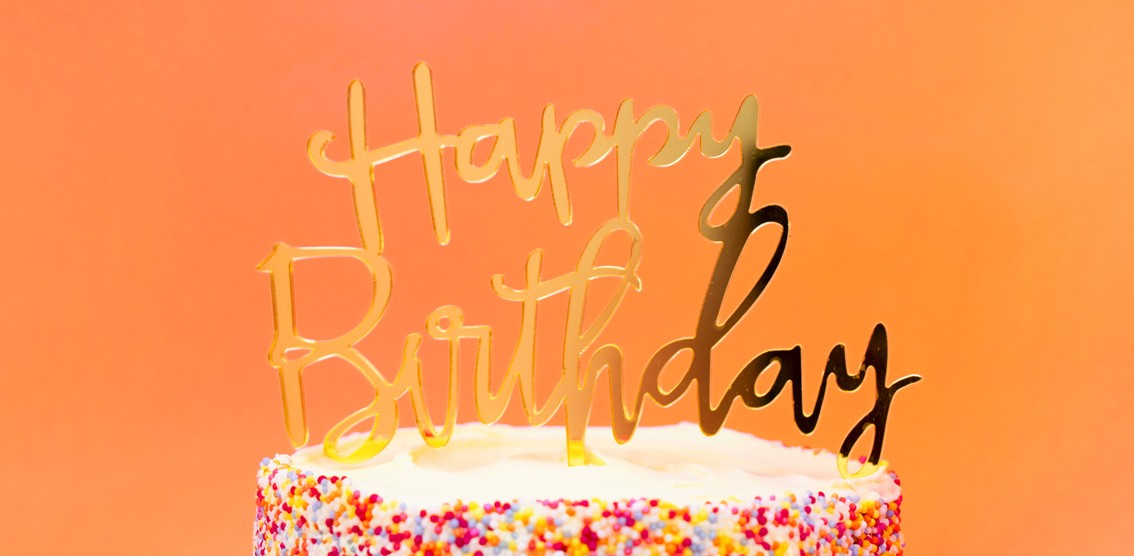 Gold acrylic Happy Birthday cake topper for birthday from Parte Haus party supply store in Bethesda Maryland