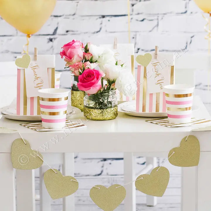 Gold pink stripes treat bag with spots and thank you tag for birthday from Parte Haus party supply store in Bethesda MD