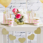 Gold pink stripes treat bag with spots and thank you tag for birthday from Parte Haus party supply store in Bethesda MD