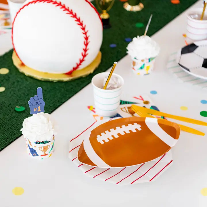Brown football shaped plates sports birthday tabletop decor from Parte Haus party supply store in Bethesda MD