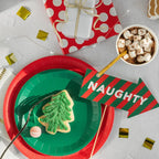 Green classic small plates with Christmas tree cookie holiday theme from Parte Haus party supply store in Bethesda Maryland