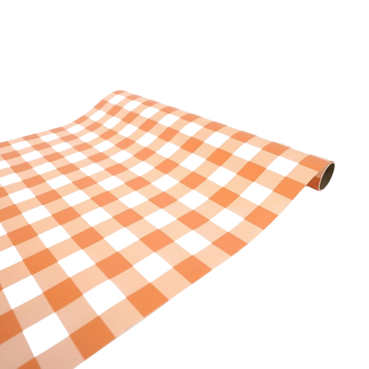 Peach checkerboard table runner with a retro design for birthdays from Parte Haus party supply store in Bethesda MD.