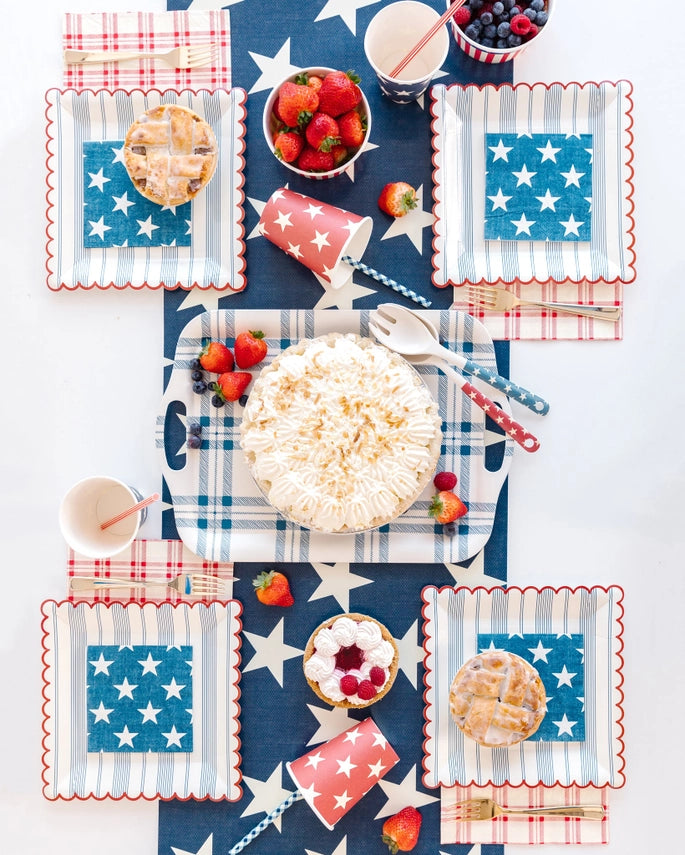 Red and blue star paper cups with patriotic theme table setting from Parte Haus party supply store in Bethesda MD