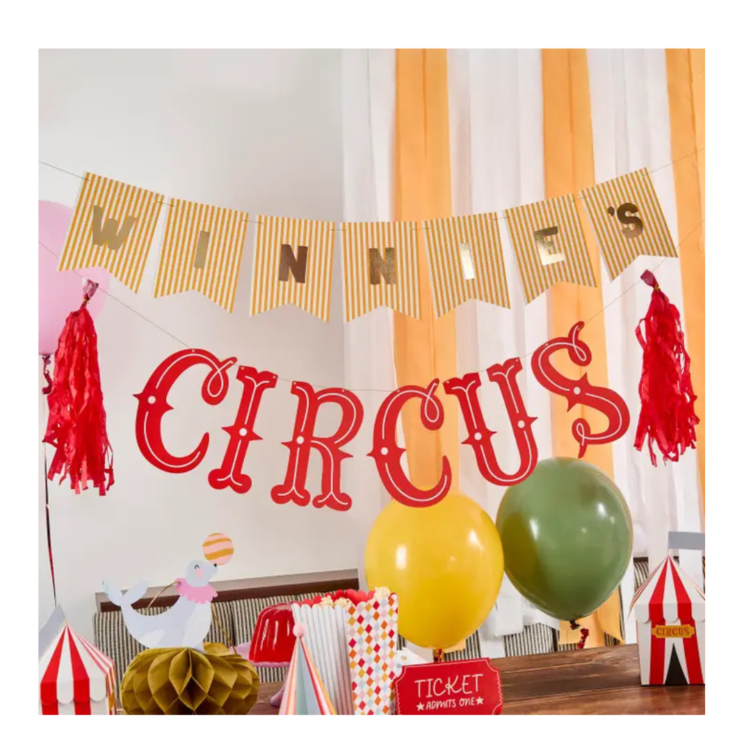 Yellow and red circus theme birthday banner and balloons party decor from Parte Haus party supply store in Bethesda MD