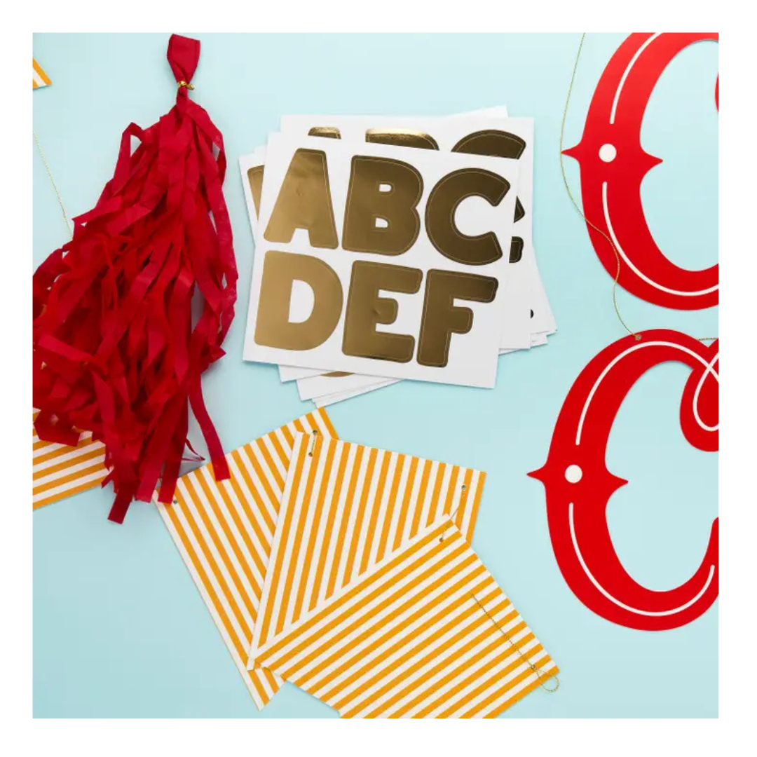 Red yellow and gold letter banner kit with red tassel for celebration from Parte Haus party supply store in Bethesda MD