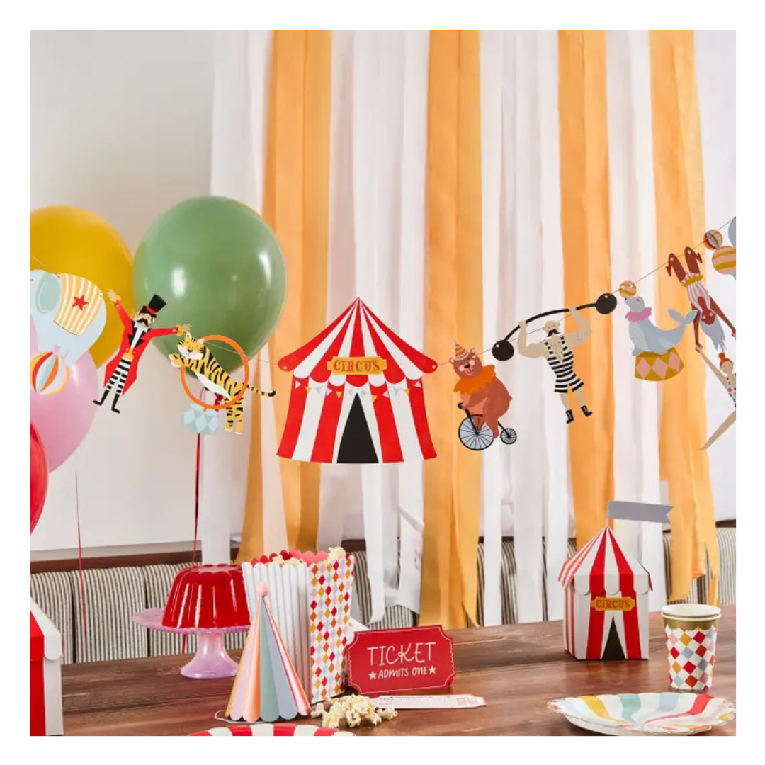 Red yellow circus birthday party tableware set with tent garland for kids from Parte Haus party supply store in Bethesda MD