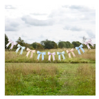 Pastel bow garland banner with pink blue and cream ribbons outdoor decoration from Parte Haus party supply store in Bethesda Maryland