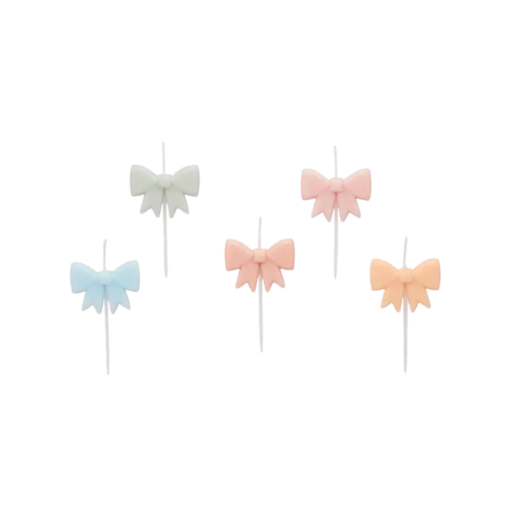 Pastel bow cake toppers set featuring blue white pink and peach for birthday from Parte Haus party supply store in Bethesda MD.