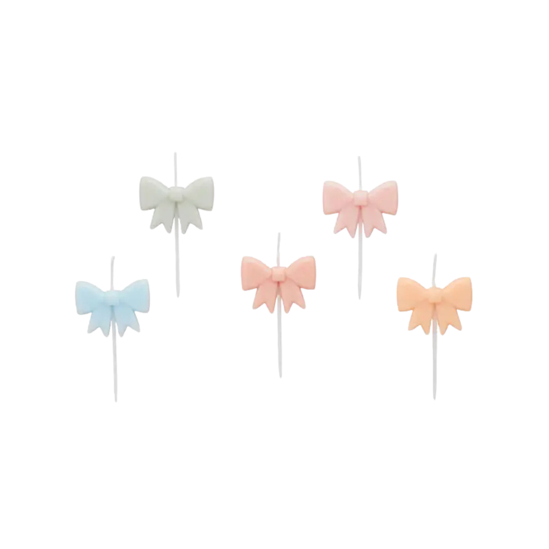 Pastel bow cake toppers set featuring blue white pink and peach for birthday from Parte Haus party supply store in Bethesda MD.