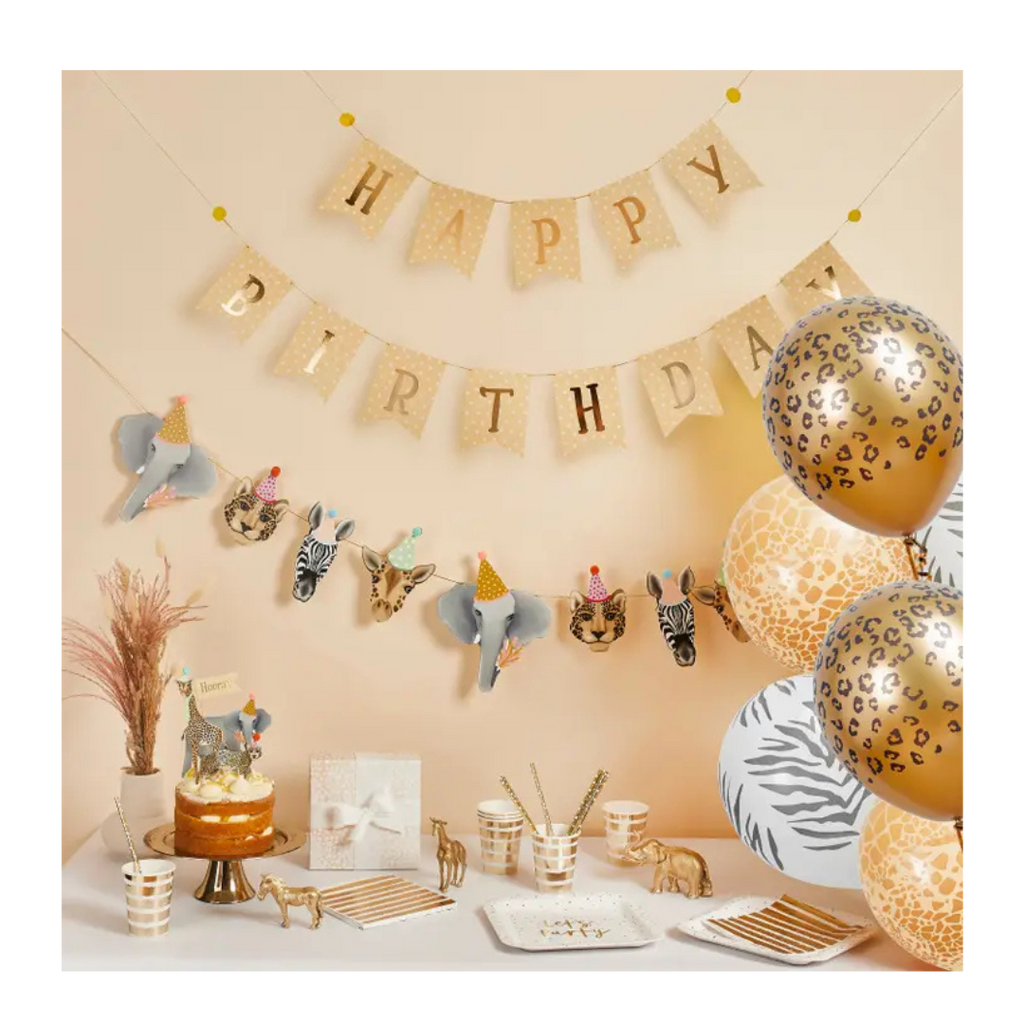 Gold and white animal print birthday decoration set with balloons cake and garlands safari theme from Parte Haus party supply store in Bethesda MD