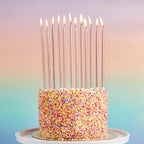 Rose gold birthday candles tall and slim on a sprinkle cake for birthdays from Parte Haus party supply store in Bethesda Maryland