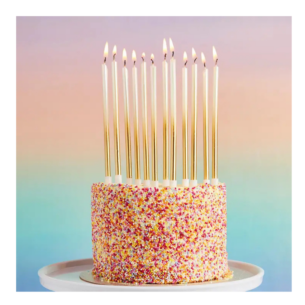 Gold birthday candles tall and elegant on cake for birthday celebration from Parte Haus party supply store in Bethesda MD