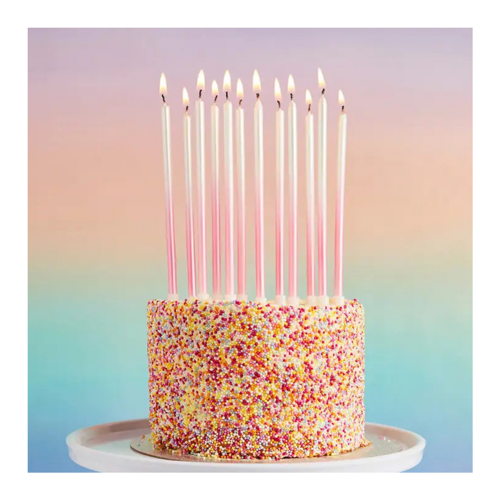 Pink tall birthday candles on sprinkle cake for birthday from Parte Haus party supply store in Bethesda MD