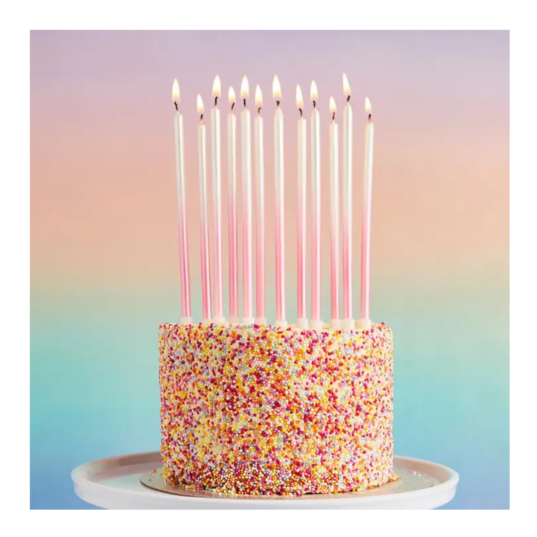 Pink tall birthday candles on sprinkle cake for birthday from Parte Haus party supply store in Bethesda MD