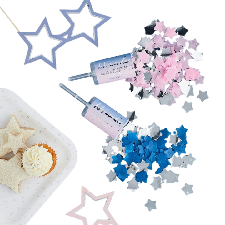 Blue and pink star confetti poppers with cupcakes and star cookies gender reveal from Parte Haus party supply store in Bethesda MD