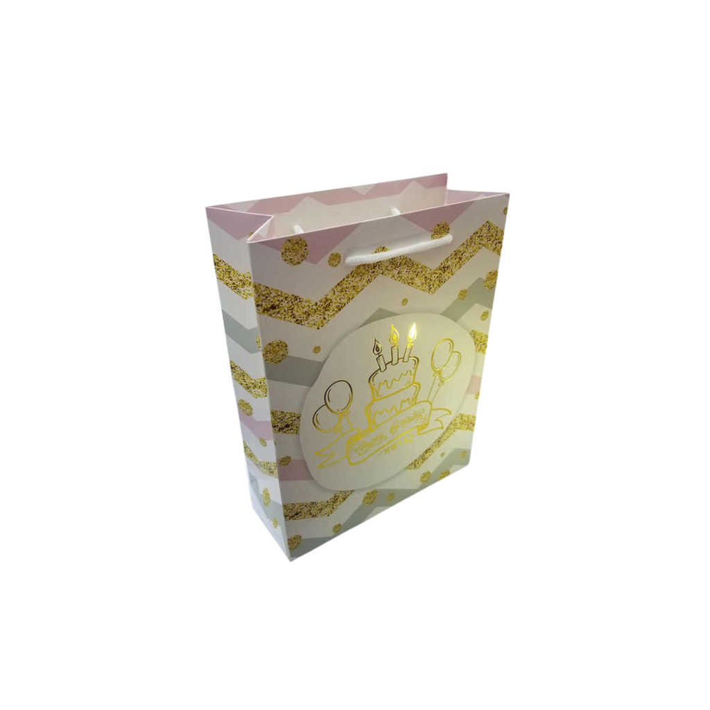 Pink and gold birthday cake gift bag with balloons for birthday from Parte Haus party supply store in Bethesda MD
