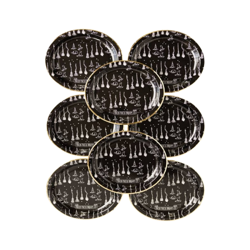 Black Halloween plates with witch and broomstick designs spooky theme from Parte Haus party supply store in Bethesda MD