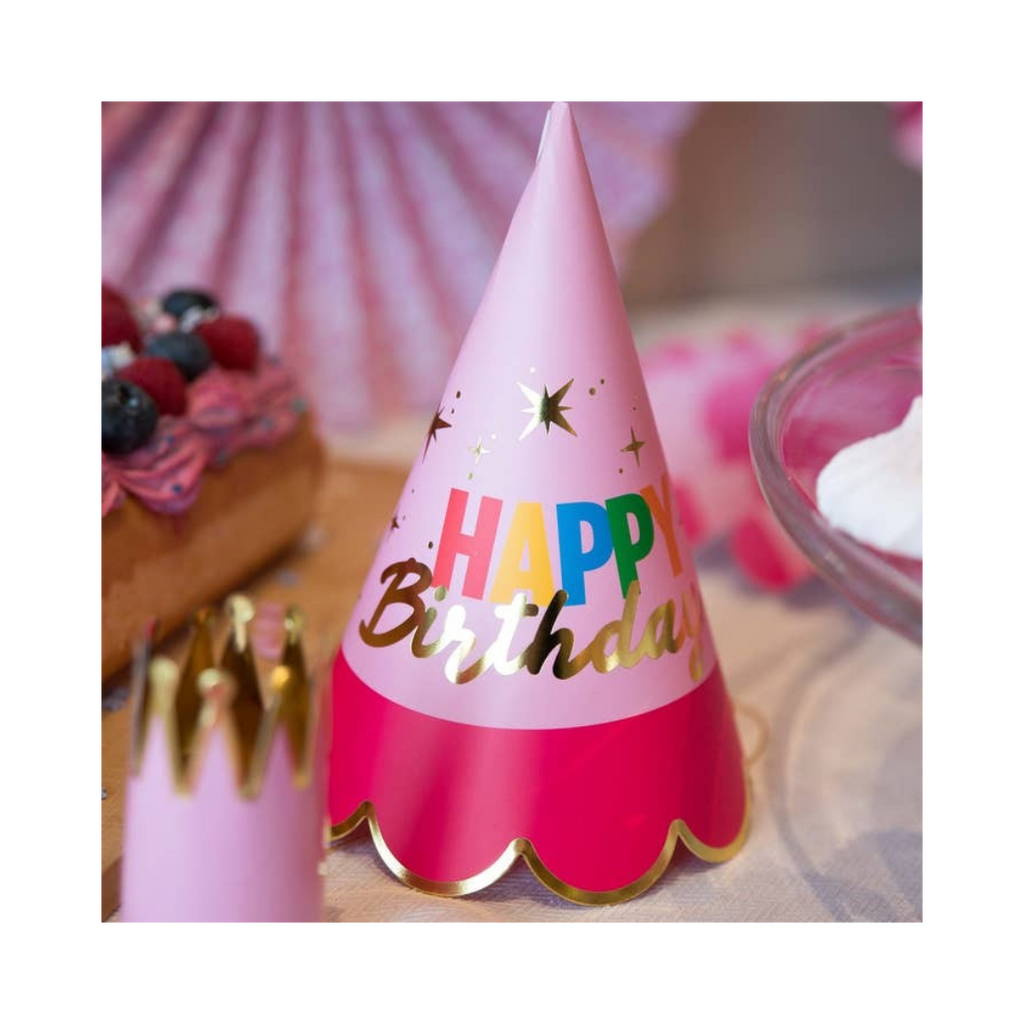 Pink birthday party hat with gold trim and Happy Birthday text for birthday parties from Parte Haus party supply store in Bethesda Maryland
