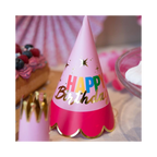 Pink birthday party hat with gold trim and Happy Birthday text for birthday parties from Parte Haus party supply store in Bethesda Maryland