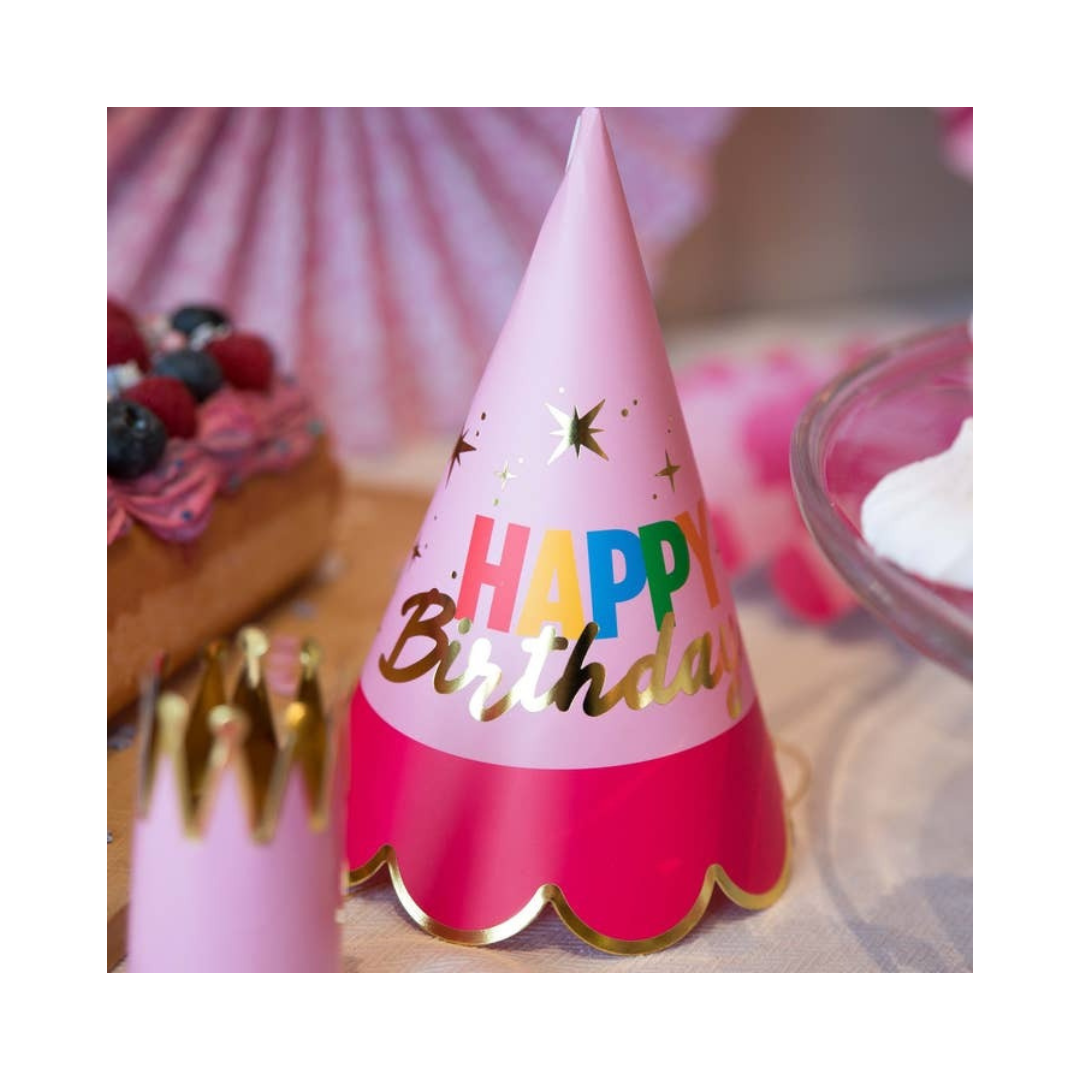 Pink birthday party hat with gold trim and Happy Birthday text for birthday parties from Parte Haus party supply store in Bethesda Maryland