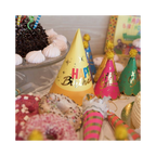 Yellow pink and green happy birthday hats with confetti decorations birthday theme from Parte Haus party supply store in Bethesda MD