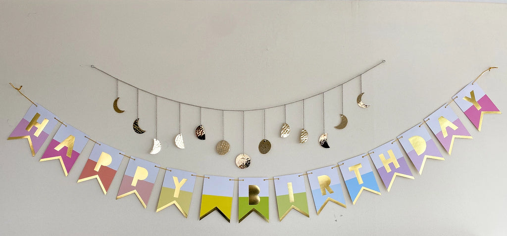 Rainbow pastel happy birthday banner with gold letters birthday theme from Parte Haus party supply store in Bethesda MD