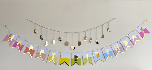 Rainbow pastel happy birthday banner with gold letters birthday theme from Parte Haus party supply store in Bethesda MD