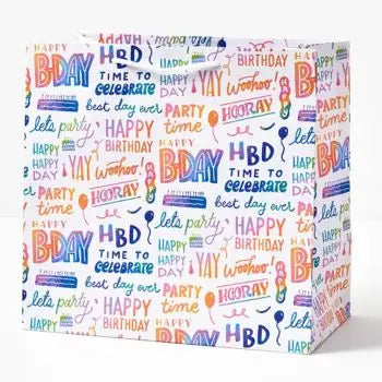 Colorful rainbow script gift bag with birthday designs for birthday from Parte Haus party supply store in Bethesda MD
